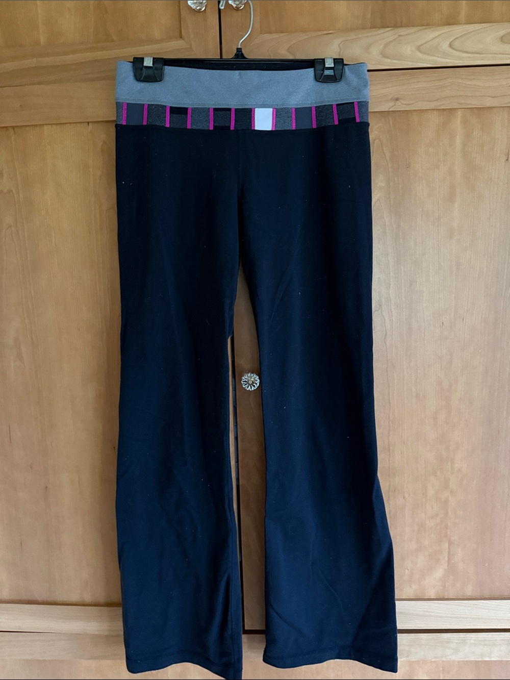 Lululemon Black Flare Yoga Pants with Gray Waistband and Pink Stripe Detail